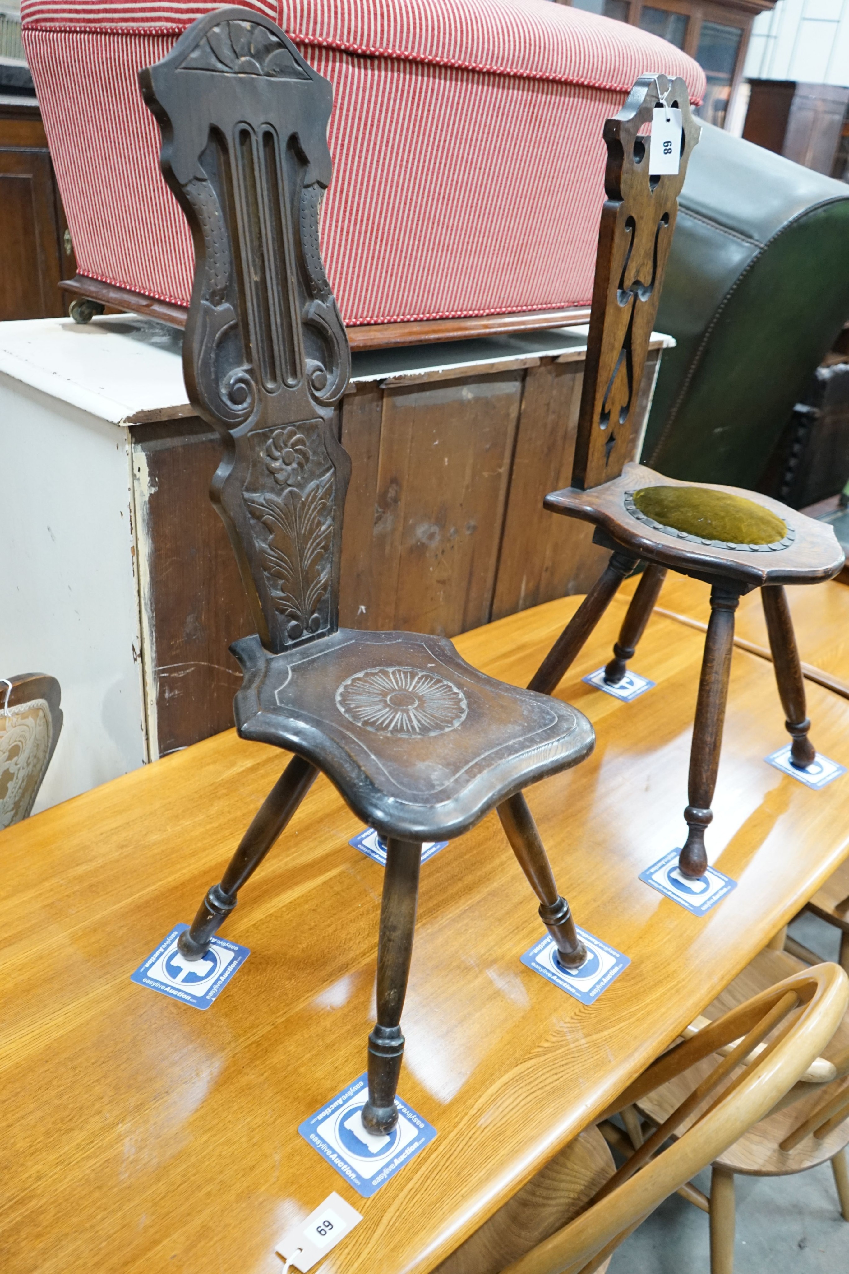 Two carved oak and beech spinning chairs